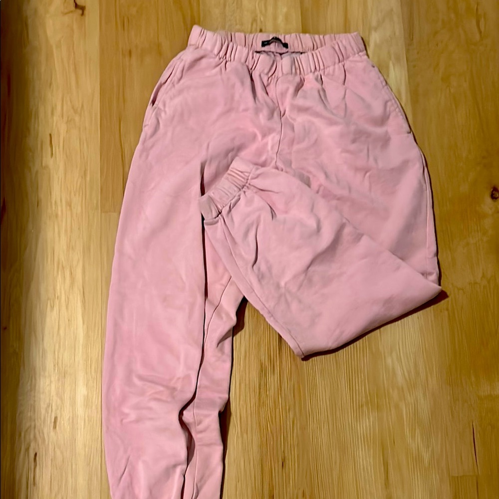 Woman’s pink Brandy Melville sweatpants